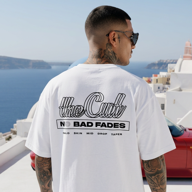 Model wearing theCut Double-Line Illusion No Bad Fades tee in white in Greece.