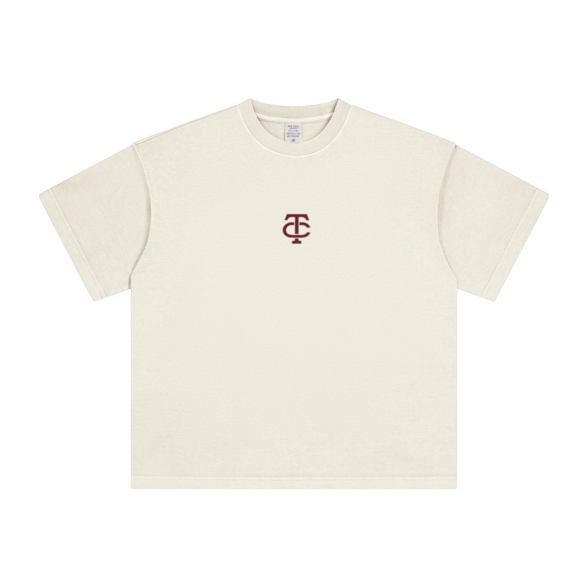 theCut TC tee in beige shown flat without print, showing the heavyweight crew neck and boxy fit.