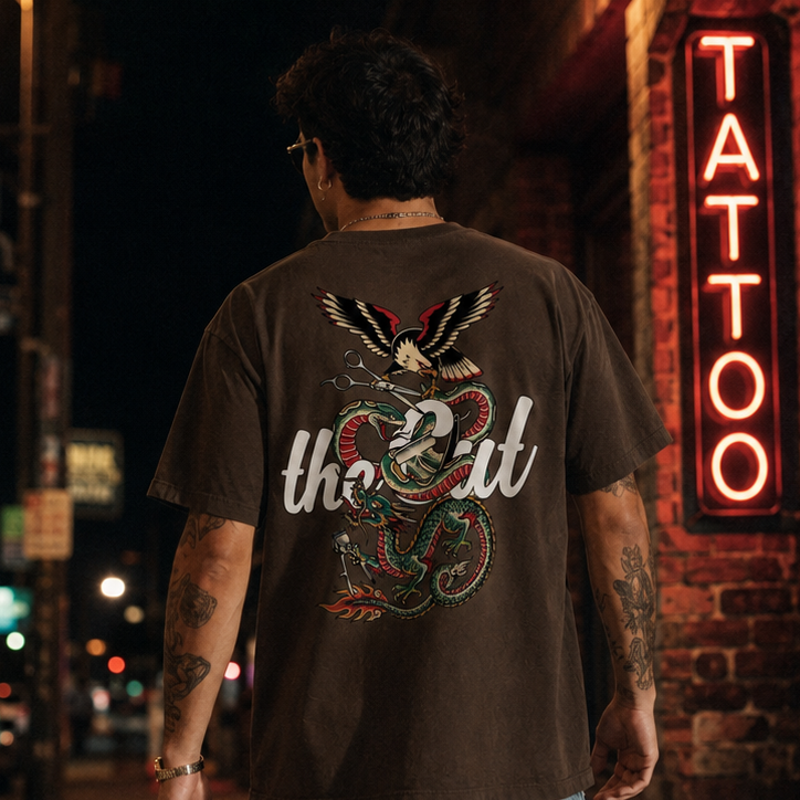 Model wearing theCut Battle Royale tee in washed brown on a city street at night.