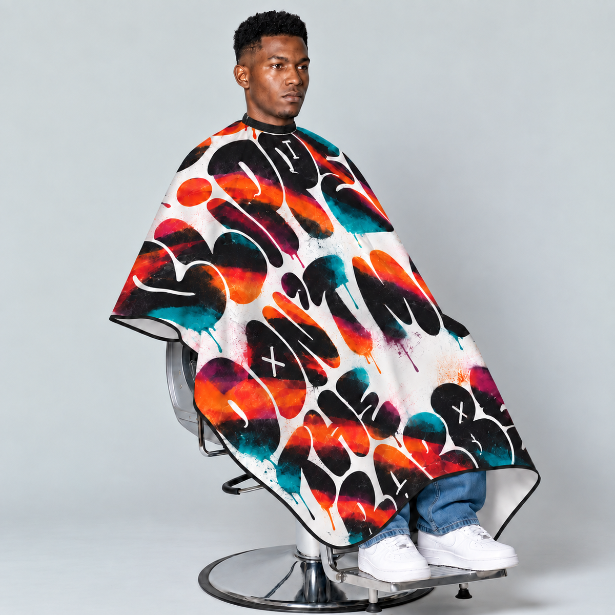 theCut Beyond the Clippers Cape — seated model view on grey background