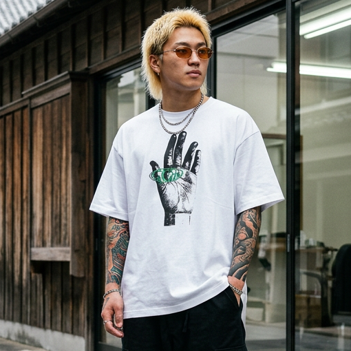 Model wearing theCut Built By Hand tee in white on a city street.