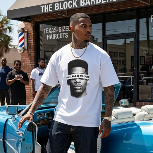Model wearing theCut High-Top No Bad Fades tee in black, standing beside a parked classic car.