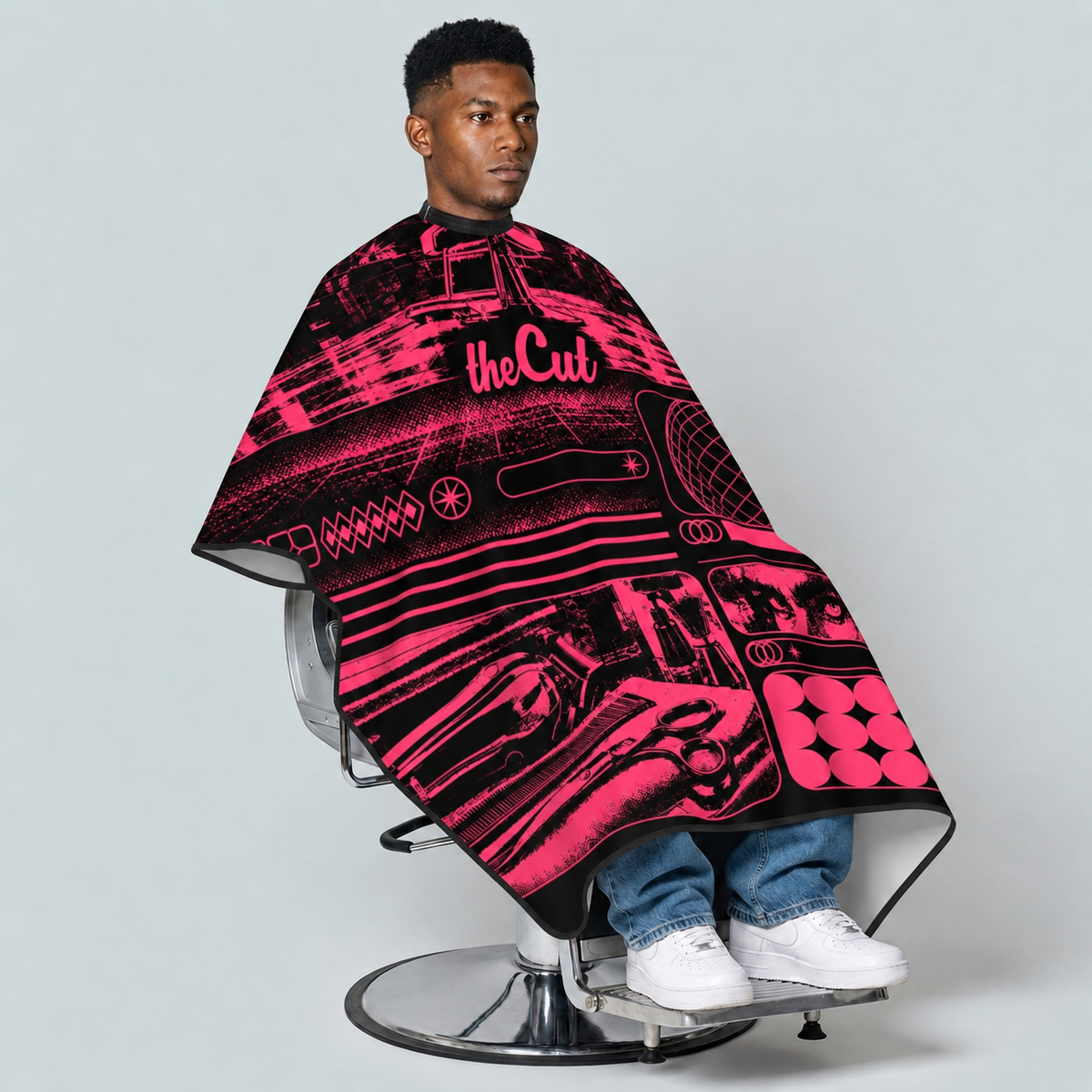 theCut Neon After Hours Cape — seated model view on grey background