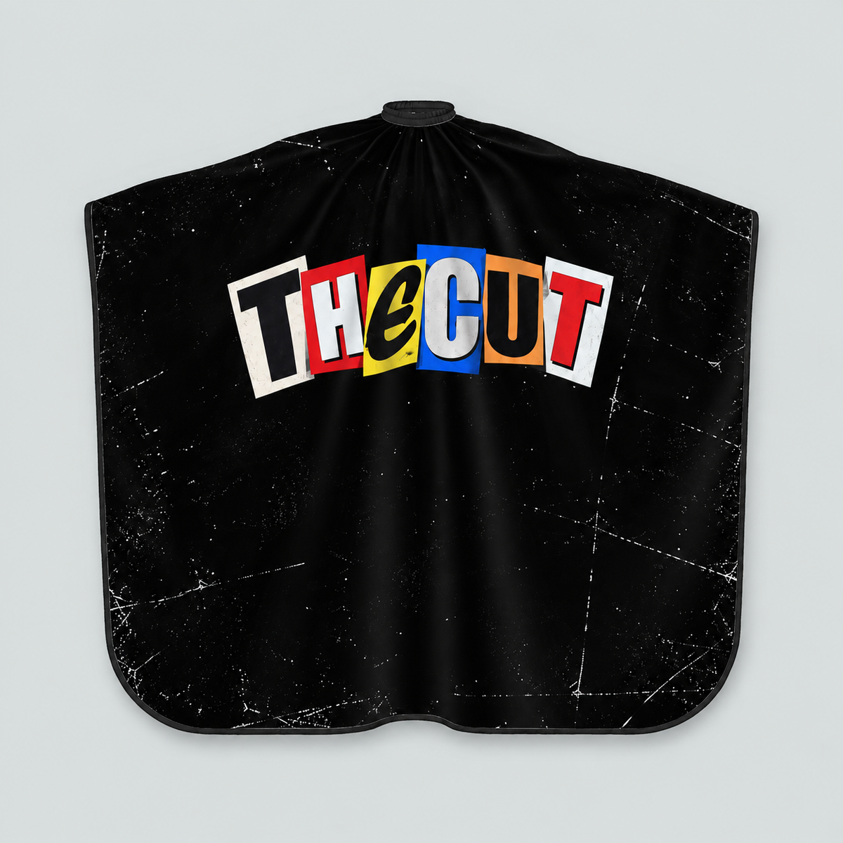 theCut Ransom Note Cape — product view on grey background