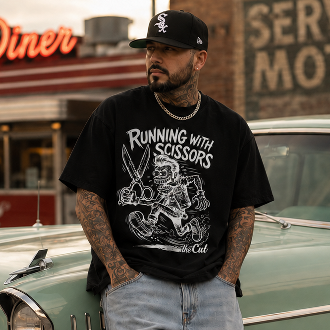 Model wearing theCut Running with Scissors tee in black beside a parked car.
