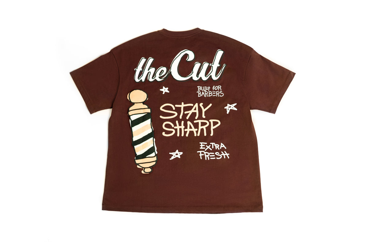 theCut Stay Sharp tee in brown shown flat, showing the Stay Sharp barber pole print.