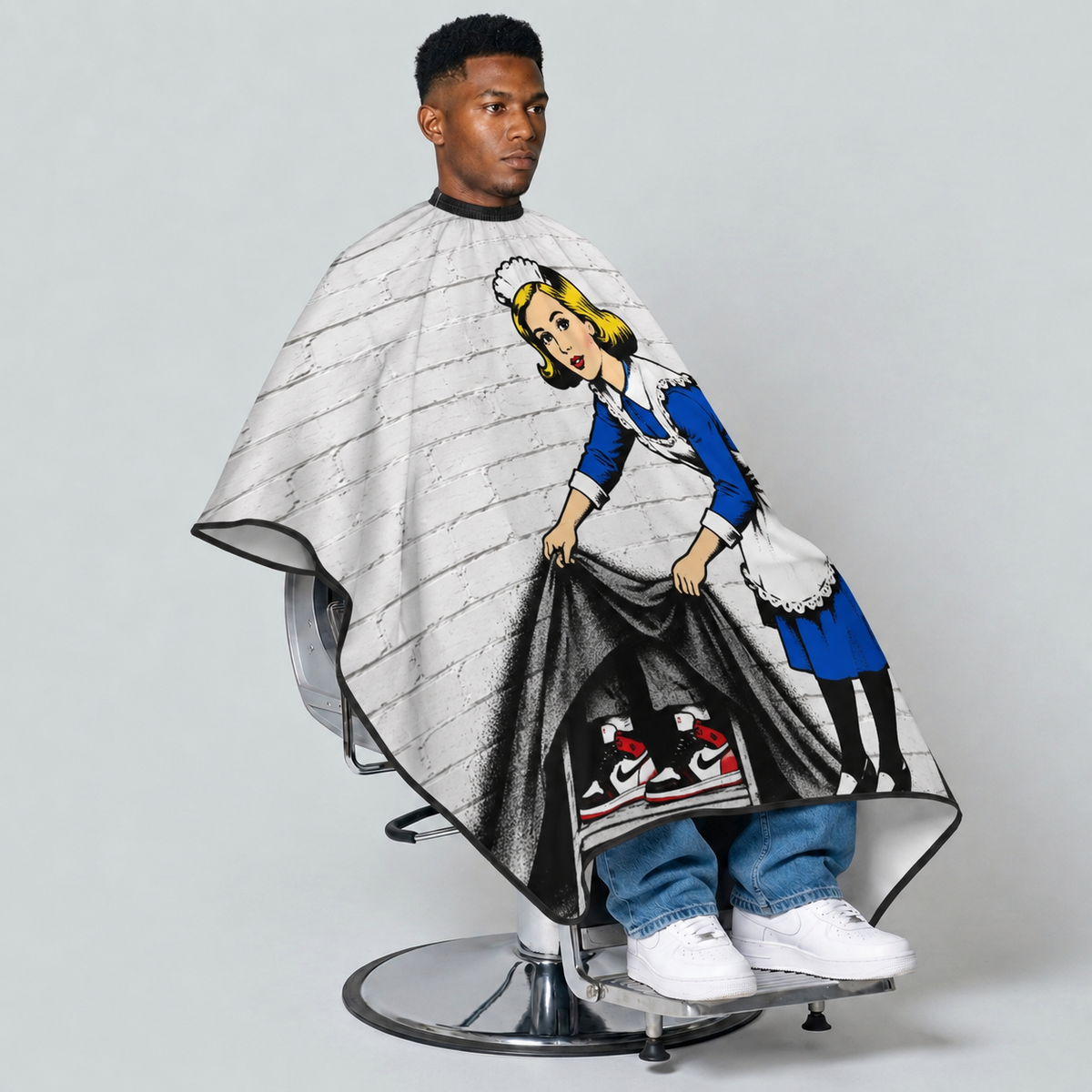 theCut Street Sweep Cape — seated view on grey background