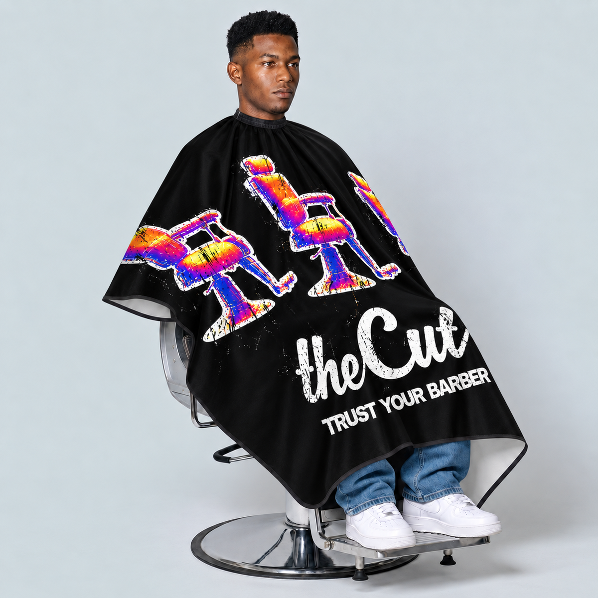 theCut Technicolor Thrones Cape — seated model view on grey background