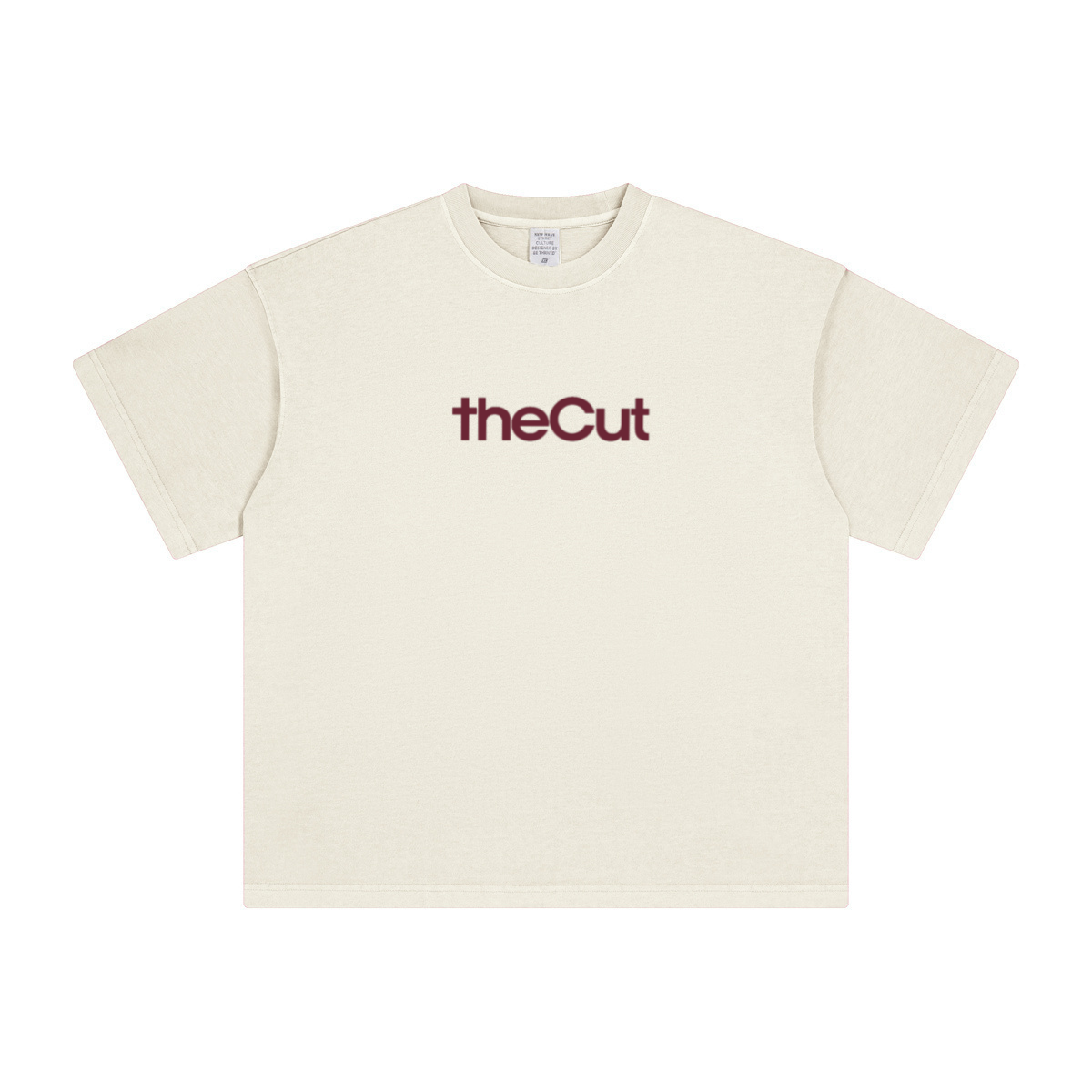 theCut tee in beige shown flat without print, showing the heavyweight crew neck and boxy fit.