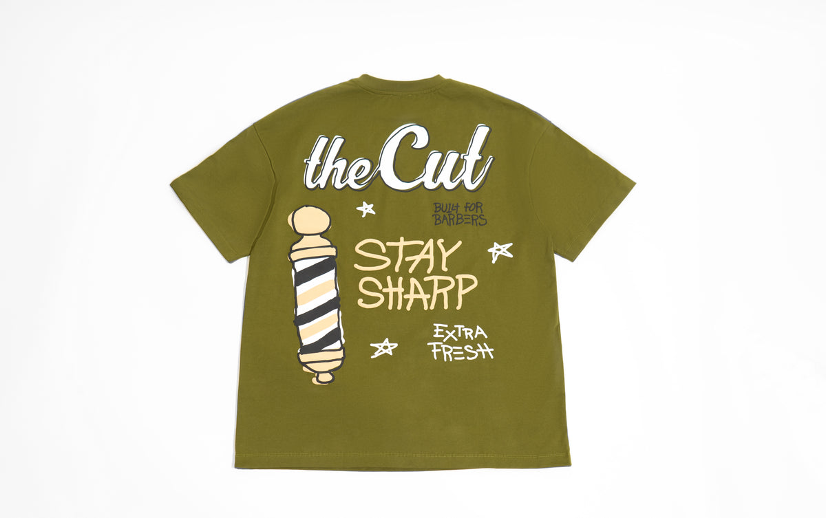theCut Stay Sharp tee in olive shown flat from the front, with a barber pole and Stay Sharp graphic.